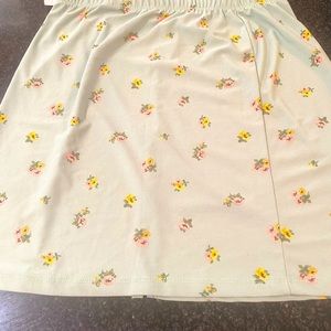 Women’s medium mini skirt. With a slit on the side.